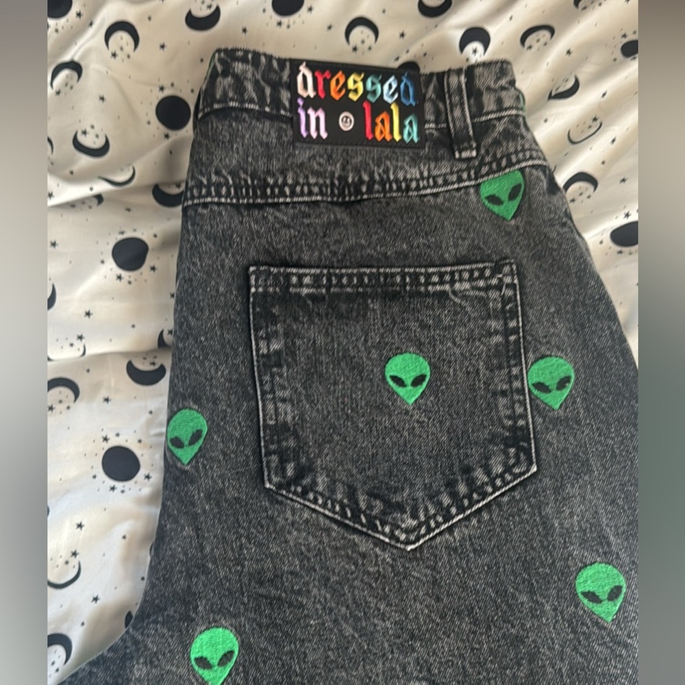 Dressed in LALA Black Flare Jeans with Green Alien Print - Picture 3 of 4